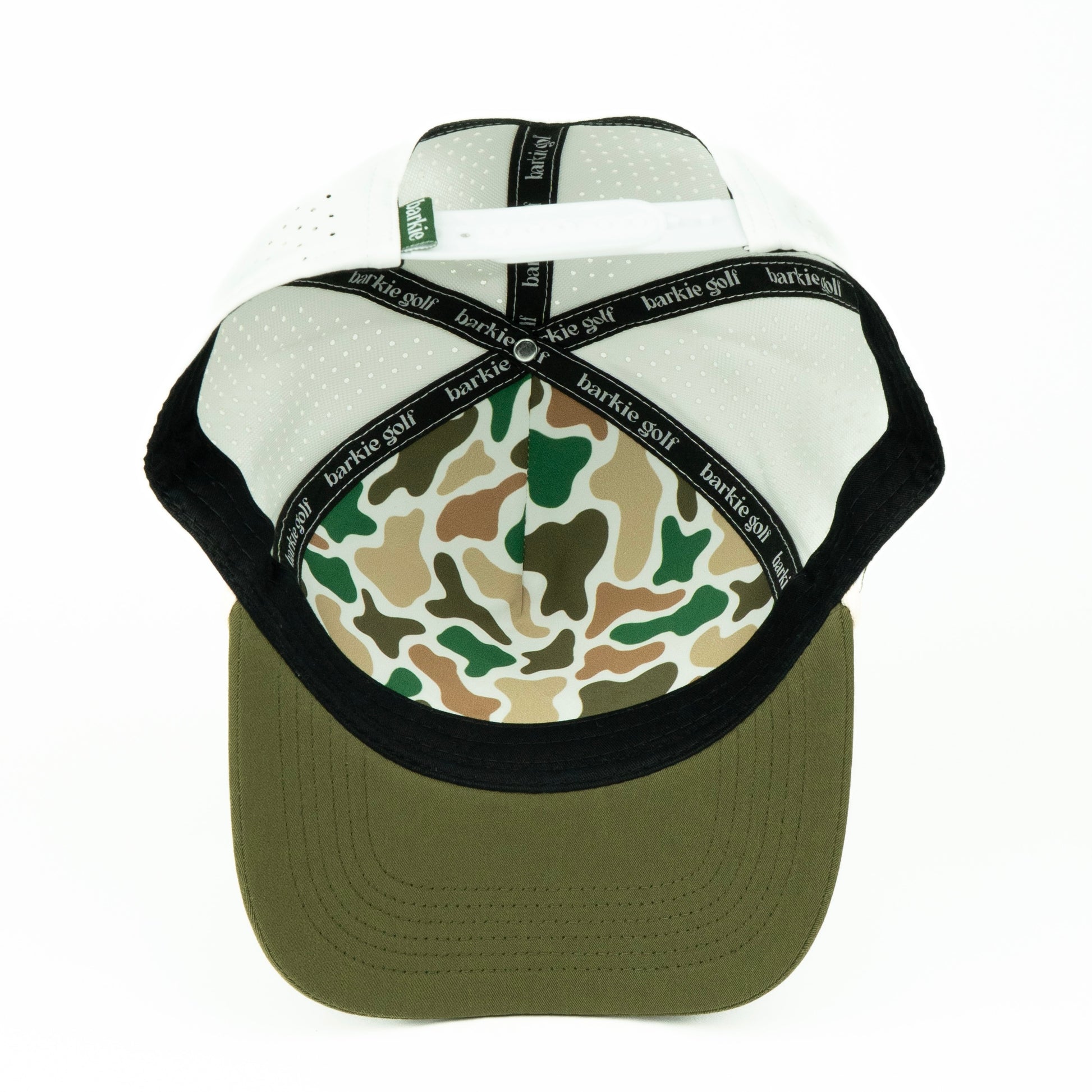white and olive cap with camouflage inner pattern on a white background